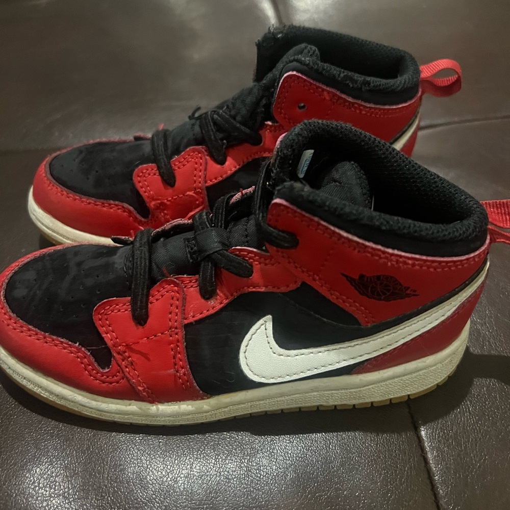Kids Red and Black Nike Sneakers